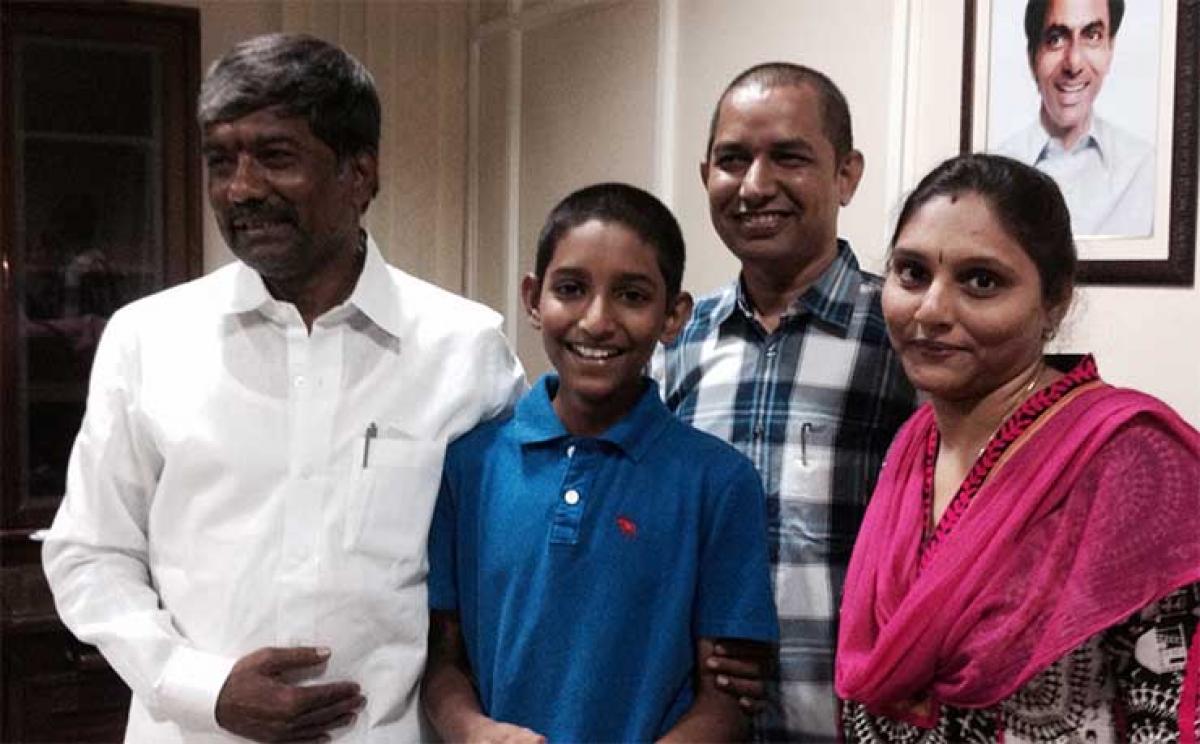 P Sai Praneeth along with his parents, Ravinder Kumar and Anupama, after being felicitated by Sports Minister T Padma Rao in Hyderabad 
